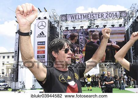 "Joachim Low celebrates with fans, reception of the German national team after their victory at the FIFA World Cup 2014, fan party at the Brandenburg Gate, Berlin, Germany, Europe" View Large Photo Image Stock Image - "Joachim Low celebrates with fans, reception of the German national team after their victory at the FIFA World Cup 2014, fan party at the Brandenburg Gate, Berlin, Germany, Europe". Fotosearch