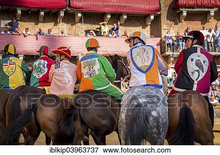 "Jockeys from six different districts waiting for the start of Palio di Siena horse race on Piazza del Campo, emblems of the contrade Civetta, Leocorno, Selva, Valdimontone, Drago and Bruco, Siena, Tuscany, Italy, Europe" View Large Photo Image Stock Photo - "Jockeys from six different districts waiting for the start of Palio di Siena horse race on Piazza del Campo, emblems of the contrade Civetta, Leocorno, Selva, Valdimontone, Drago and Bruco, Siena, Tuscany, Italy, Europe". Fotosearch