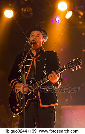 "Joe Buchli, singer and guitarist of the Swiss band 77 Bombay Street, performing live at the Schueuer, Lucerne, Switzerland, Europe" View Large Photo Image Stock Photo - "Joe Buchli, singer and guitarist of the Swiss band 77 Bombay Street, performing live at the Schueuer, Lucerne, Switzerland, Europe". Fotosearch