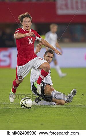 "Julian Baumgartlinger, #14 Austria, and Miroslav Klose, #11 Germany, fight for the ball during the WC qualifier soccer game on September 11, 2012 in Vienna, Austria, Europe" View Large Photo Image Stock Photo - "Julian Baumgartlinger, #14 Austria, and Miroslav Klose, #11 Germany, fight for the ball during the WC qualifier soccer game on September 11, 2012 in Vienna, Austria, Europe". Fotosearch
