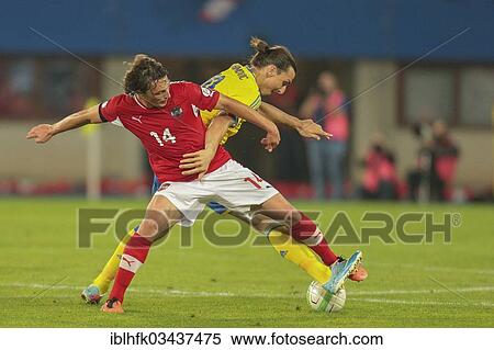 "Julian Baumgartlinger, No. 14 Austria, and Zlatan Ibrahimovic, No. 10 Sweden, fight for the ball during the world cup qualifier game on June 7, 2013 in Ernst-Happel-Stadion, Vienna, Vienna State, Austria, Europe" View Large Photo Image Stock Photography - "Julian Baumgartlinger, No. 14 Austria, and Zlatan Ibrahimovic, No. 10 Sweden, fight for the ball during the world cup qualifier game on June 7, 2013 in Ernst-Happel-Stadion, Vienna, Vienna State, Austria, Europe". Fotosearch