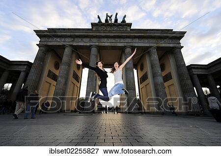 "Jumping for joy, two girls jumping in the air in front of the Brandenburg Gate, Berlin, Germany, Europe" View Large Photo Image Stock Photo - "Jumping for joy, two girls jumping in the air in front of the Brandenburg Gate, Berlin, Germany, Europe". Fotosearch
