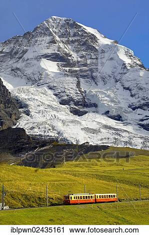 "Junfraujoch funicular railway in front of the Moench from Kleine Scheidegg, Grindelwald, Alps, Switzerland, Europe" View Large Photo Image Stock Image - "Junfraujoch funicular railway in front of the Moench from Kleine Scheidegg, Grindelwald, Alps, Switzerland, Europe". Fotosearch