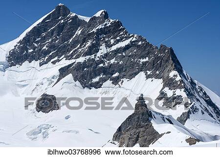 "Jungfraujoch saddle, behind the summit of Mt. Jungfrau, Swiss Alps Jungfrau-Aletsch UNESCO World Heritage, Berne Canton, Switzerland, Europe" View Large Photo Image Stock Photograph - "Jungfraujoch saddle, behind the summit of Mt. Jungfrau, Swiss Alps Jungfrau-Aletsch UNESCO World Heritage, Berne Canton, Switzerland, Europe". Fotosearch