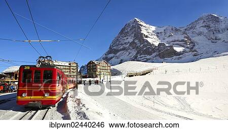 "Jungfraujoch train at Kleiner Scheidegg in winter with the mountains Eiger, left, and Moench, Swiss Alps, Switzerland, Europe" View Large Photo Image Stock Photograph - "Jungfraujoch train at Kleiner Scheidegg in winter with the mountains Eiger, left, and Moench, Swiss Alps, Switzerland, Europe". Fotosearch