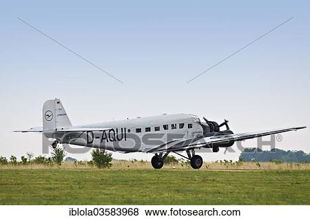 Stock Photo - "Junkers JU 52, a historic three-engined airliner at take-off, Mainz-Finthen, Mainz, Rhineland-Palatinate, Germany, Europe". Fotosearch