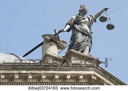 Stock Image - "Justice holding her sword and scales, sculpture on the Guildhall, Bath, England, United Kingdom, Europe". Fotosearch