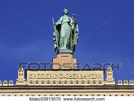"Justizia, gable figure on the building of the Government of Upper Bavaria, Munich, Bavaria, Germany, Europe" View Large Photo Image Stock Image - "Justizia, gable figure on the building of the Government of Upper Bavaria, Munich, Bavaria, Germany, Europe". Fotosearch
