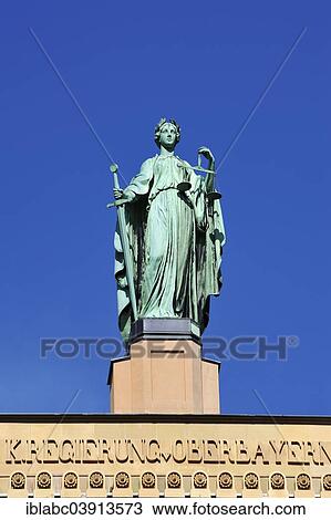 "Justizia, gable figure on the building of the Government of Upper Bavaria, Munich, Bavaria, Germany, Europe" View Large Photo Image Stock Image - "Justizia, gable figure on the building of the Government of Upper Bavaria, Munich, Bavaria, Germany, Europe". Fotosearch