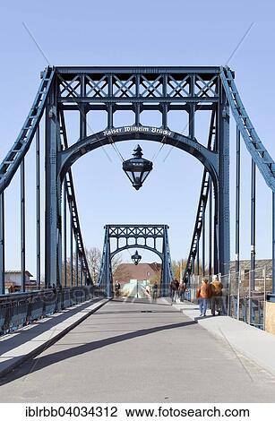 Stock Image - "Kaiser Wilhelm Bridge, historic swing bridge from 1907 in the harbour, Wilhelmshaven, Lower Saxony, Germany, Europe". Fotosearch