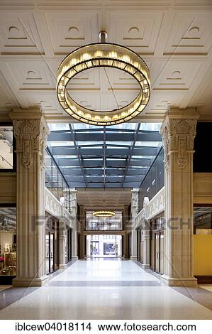 Picture - "Kaisergalerie mall, atrium with terrazzo floor, design ring light on renovated coffered ceiling and 7. 50 meter high sandstone pillars with carved crowns and ornaments, Hamburg, Germany, Europe". Fotosearch