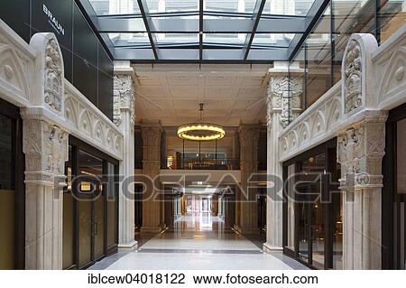 Stock Image - "Kaisergalerie mall, atrium with terrazzo floor, renovated coffered ceiling and 7. 50 meter high sandstone pillars with carved crowns and ornaments, Hamburg, Germany, Europe". Fotosearch