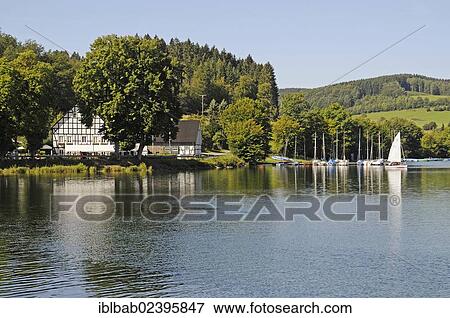 "Kalberschnacke estate, restaurant, harbor, Kalberschnacke bay, Listertalsperre dam, lake Listersee, reservoir, Olpe, Ebbegebirge nature park, Sauerland, North Rhine-Westphalia, Germany, Europe, PublicGround, Europe" View Large Photo Image Stock Photo - "Kalberschnacke estate, restaurant, harbor, Kalberschnacke bay, Listertalsperre dam, lake Listersee, reservoir, Olpe, Ebbegebirge nature park, Sauerland, North Rhine-Westphalia, Germany, Europe, PublicGround, Europe". Fotosearch