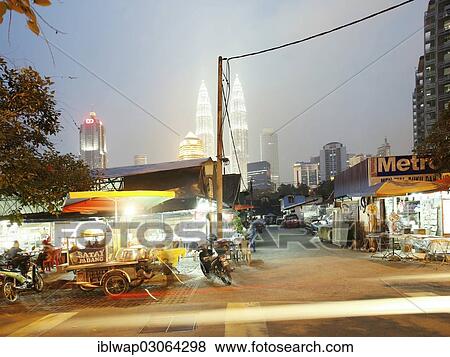 "Kampung Baru district, Petronas Twin Towers at back, Kampung Baru, Kuala Lumpur, Malaysia, Asia" View Large Photo Image Stock Photo - "Kampung Baru district, Petronas Twin Towers at back, Kampung Baru, Kuala Lumpur, Malaysia, Asia". Fotosearch