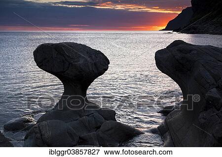 Stock Photo - "Kannestein or Kanne Stone with coastline at sunset, Vagsoy island, Sogn og Fjordane, Norway, Europe". Fotosearch