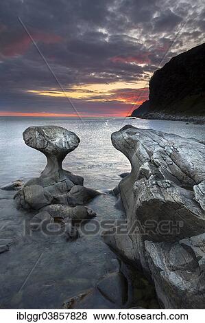 "Kannestein or Kanne Stone with coastline at sunset, Vagsoy island, Sogn og Fjordane, Norway, Europe" View Large Photo Image Stock Photo - "Kannestein or Kanne Stone with coastline at sunset, Vagsoy island, Sogn og Fjordane, Norway, Europe". Fotosearch