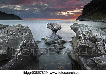 "Kannestein or Kanne Stone with coastline at sunset, Vagsoy island, Sogn og Fjordane, Norway, Europe" View Large Photo Image Stock Photo - "Kannestein or Kanne Stone with coastline at sunset, Vagsoy island, Sogn og Fjordane, Norway, Europe". Fotosearch