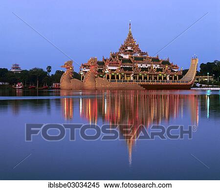Stock Photography - "Karaweik ship restaurant on Lake Kandawgyi at dusk, Rangun, Yangon Region, Myanmar, Burma, Asia". Fotosearch