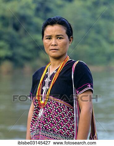 Stock Photo - "Karen woman with traditional clothing, next to the River Kok, Chiang Rai Province, Northern Thailand, Thailand, Asia". Fotosearch