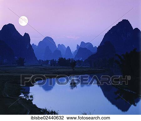 "Karst mountain landscape along the Yulong River, full moon, Yangshuo, Li Jiang River, Guilin, Guangxi, China, Asia" View Large Photo Image Stock Image - "Karst mountain landscape along the Yulong River, full moon, Yangshuo, Li Jiang River, Guilin, Guangxi, China, Asia". Fotosearch