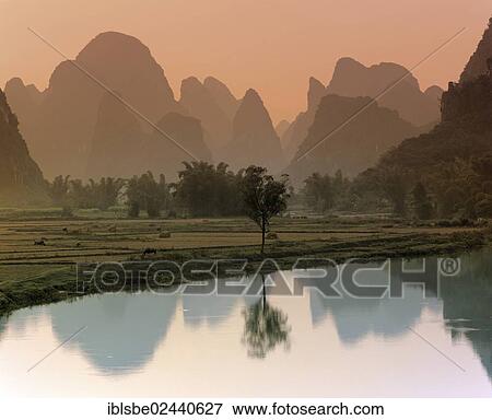"Karst mountain landscape along the Yulong River, Yangshuo, Li Jiang River, Guilin, Guangxi, China, Asia" View Large Photo Image Stock Photo - "Karst mountain landscape along the Yulong River, Yangshuo, Li Jiang River, Guilin, Guangxi, China, Asia". Fotosearch
