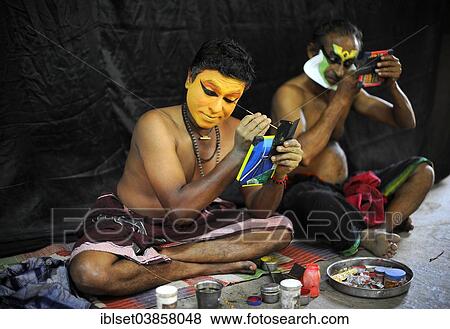 Stock Photo - "Kathakali actors applying makeup, Varkala, Kerala, South West India, India, Asia". Fotosearch