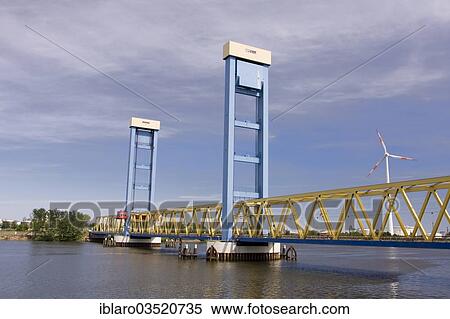 Stock Photography - "Kattwyk Bridge, truss bridge or vertical lift bridge over the Suederelbe river, Moorburg, Hamburg, Hamburg, Germany, Europe". Fotosearch