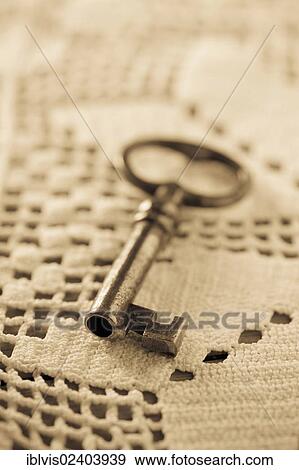 Key lying on tablecloth View Large Photo Image Stock Photo - Key lying on tablecloth. Fotosearch