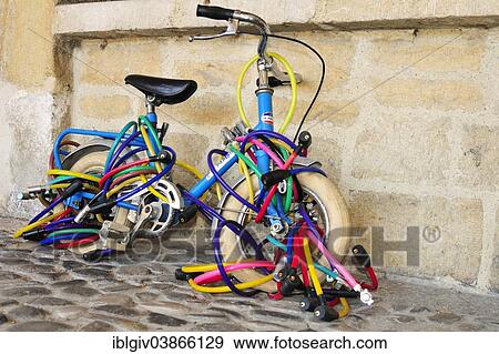 "Kid's bike with many locks, Annecy, Haute-Savoie, Rhone-Alpes region, France, Europe" View Large Photo Image Stock Photo - "Kid's bike with many locks, Annecy, Haute-Savoie, Rhone-Alpes region, France, Europe". Fotosearch