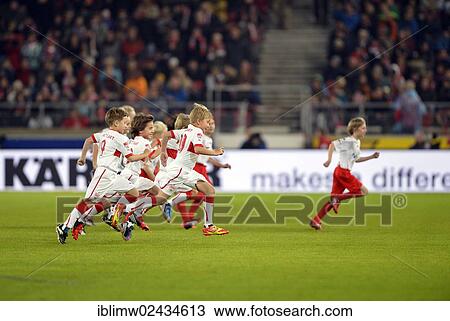 Stock Image - "Kids escorting players, Mercedes-Benz Arena, Stuttgart, Baden-Wuerttemberg, Germany, Europe". Fotosearch