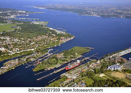 "Kiel-Holtenau canal locks, northern end of the Kiel Canal, Nord-Ostsee-Kanal, aerial view, Kiel, Schleswig-Holstein, Germany, Europe" View Large Photo Image Stock Photo - "Kiel-Holtenau canal locks, northern end of the Kiel Canal, Nord-Ostsee-Kanal, aerial view, Kiel, Schleswig-Holstein, Germany, Europe". Fotosearch