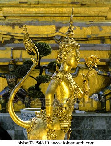 Stock Image - "Kinnari, Kinnorn or Kinnare statue, mythical creature, Wat Phra Kaeo Temple, Royal Palace, Bangkok, Central Thailand, Thailand, Asia". Fotosearch