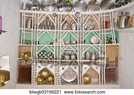 Stock Image - "Kitchen shelf in a traditional kitchen, built from wire and sticks, covered with a mixture of cow dung and sand, then painted white, Wuste Thar, Rajasthan, India, Asia". Fotosearch