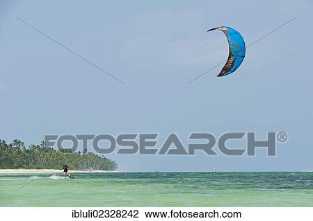"Kite surfer in Bwejuu, east coast of Zanzibar, Tanzania, Africa" View Large Photo Image Stock Image - "Kite surfer in Bwejuu, east coast of Zanzibar, Tanzania, Africa". Fotosearch