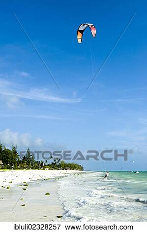 "Kite surfer in Paje, east coast of Zanzibar, Tanzania, Africa" View Large Photo Image Stock Photo - "Kite surfer in Paje, east coast of Zanzibar, Tanzania, Africa". Fotosearch