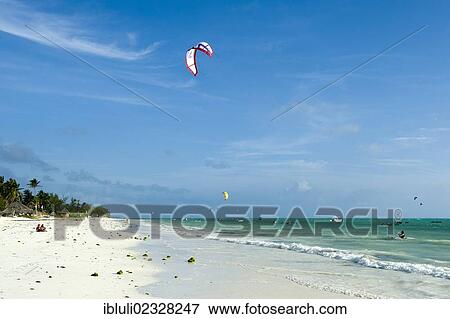 "Kite surfers in Paje, east coast of Zanzibar, Tanzania, Africa" View Large Photo Image Stock Photo - "Kite surfers in Paje, east coast of Zanzibar, Tanzania, Africa". Fotosearch