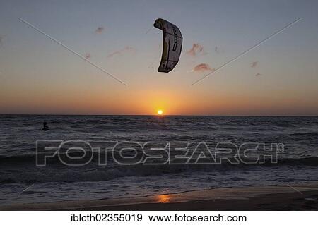 Stock Photo - "Kitesurfer at sunset, North Sea, Sylt, Schleswig-Holstein, Germany, Europe". Fotosearch