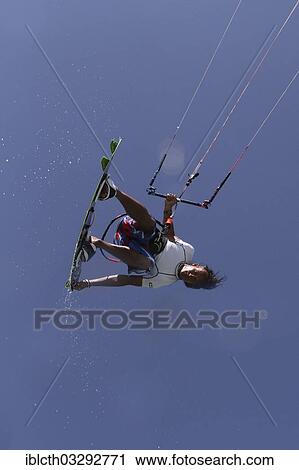 "Kitesurfer jumping with splashing water, El Gouna, Red Sea Governorate, Egypt, Africa" View Large Photo Image Stock Image - "Kitesurfer jumping with splashing water, El Gouna, Red Sea Governorate, Egypt, Africa". Fotosearch