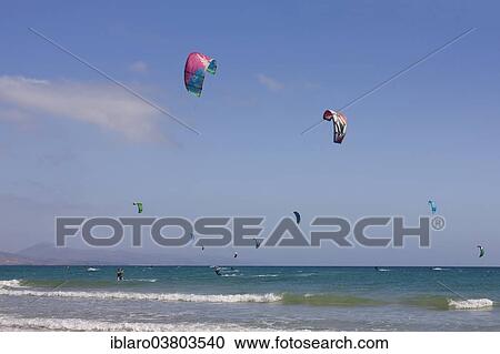 Stock Image - "Kitesurfing at Playa Bajo beach, Corralejo, Fuerteventura, Canary Islands, Spain, Europe". Fotosearch
