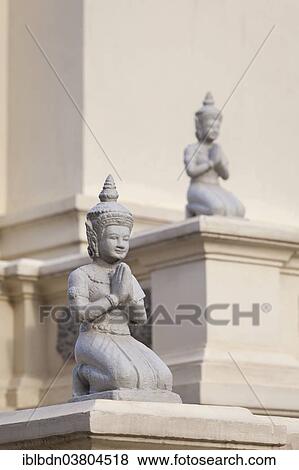 "Kneeling statues adorn the Mondapa of Satra and Tripitaka, housing the Royal Library, Royal Palace, Phnom Penh, Cambodia, Asia" View Large Photo Image Stock Photo - "Kneeling statues adorn the Mondapa of Satra and Tripitaka, housing the Royal Library, Royal Palace, Phnom Penh, Cambodia, Asia". Fotosearch