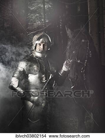 "Knight wearing armour standing beside his horse in the woods, Tyrol, Austria, Europe" View Large Photo Image Picture - "Knight wearing armour standing beside his horse in the woods, Tyrol, Austria, Europe". Fotosearch