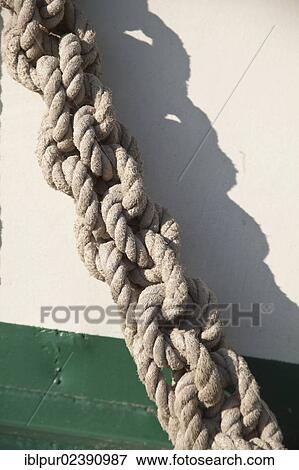 "Knotted rope, detail view of a small sailing ship in the harbour of Greifswald, Mecklenburg-Western Pomerania, Germany, Europe" View Large Photo Image Stock Photo - "Knotted rope, detail view of a small sailing ship in the harbour of Greifswald, Mecklenburg-Western Pomerania, Germany, Europe". Fotosearch