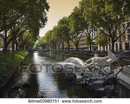 "Ko-Graben, an avenue along the Dussel at the Stadtgraben canal, Ko shopping street, Konigsallee, Dusseldorf, North Rhine-Westphalia, Germany, Europe" View Large Photo Image Stock Image - "Ko-Graben, an avenue along the Dussel at the Stadtgraben canal, Ko shopping street, Konigsallee, Dusseldorf, North Rhine-Westphalia, Germany, Europe". Fotosearch