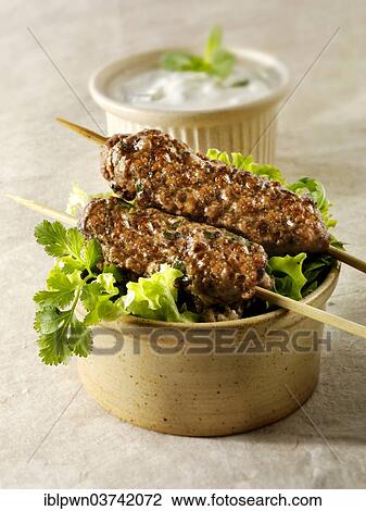 Kofte kebabs with salad and yoghurt View Large Photo Image Stock Image - Kofte kebabs with salad and yoghurt. Fotosearch