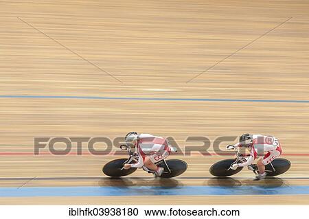 Stock Image - "Krysztof Maksel, No. 40 Poland, and Rafal Sarnecki, No. 43 Poland, place second in the men's elite team sprint qualification at the GP Vienna 2013, Ferry-Dusika-Stadium, Vienna, Austria, Europe". Fotosearch