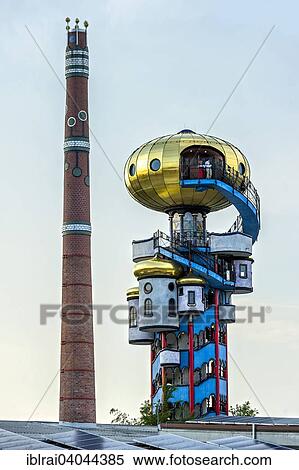 Stock Photography - "Kuchlbauer Tower, also Hundertwasser Tower by Friedensreich Hundertwasser and Peter Pelican in the beer garden of the Kuchlbauer Brewery, with the chimney of the brewery, Kuchlbauer's World of Beer, Abensberg, Lower Bavaria, Bavaria, Germany, Europe". Fotosearch
