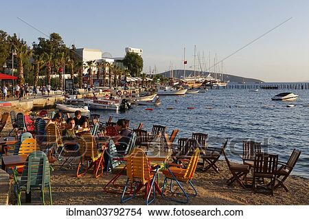 "Kumbahce bay with Halicarnassus Club, tables and chairs on the beach, Bodrum, Mugla, Aegean Region, Turkey, Asia" View Large Photo Image Picture - "Kumbahce bay with Halicarnassus Club, tables and chairs on the beach, Bodrum, Mugla, Aegean Region, Turkey, Asia". Fotosearch
