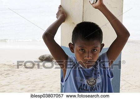 Stock Photo - "Kuna Indian boy in a Kuna Indian village, Nalunega, San Blas Islands, Panama, North America". Fotosearch