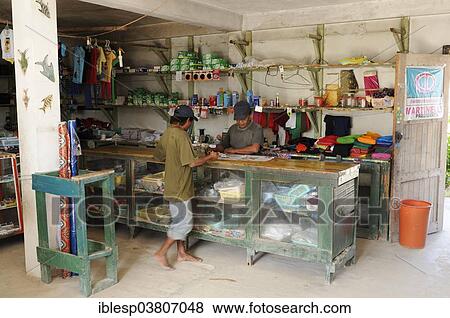 Stock Photo - "Kuna Indian men in a store in a Kuna Indian village, Nalunega, San Blas Islands, Panama, North America". Fotosearch
