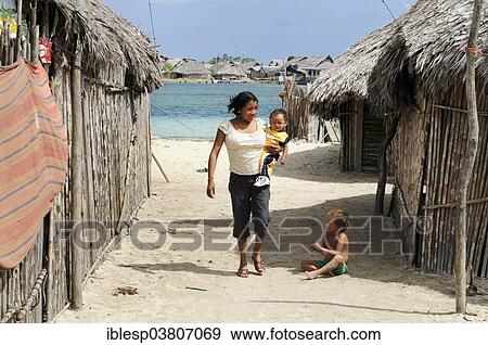 Stock Photo - "Kuna Indian woman and children, Nalunega, San Blas Islands, Caribbean, Panama, North America". Fotosearch